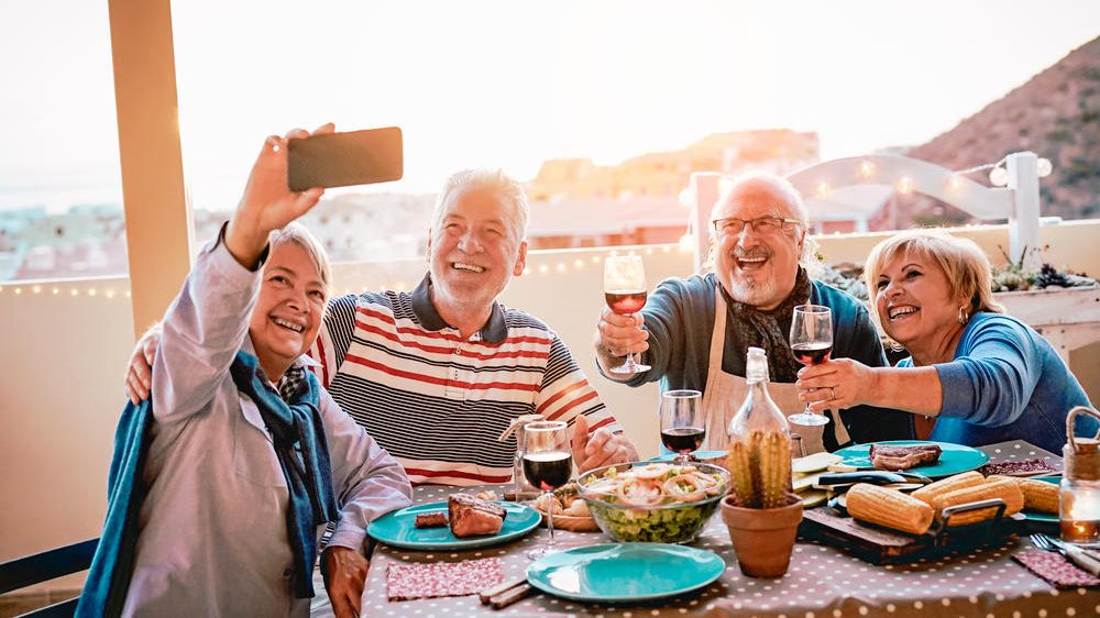Happy,Seniors,Friends,Taking,Selfie,With,Mobile,Smartphone,Camera,At