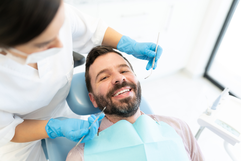 Man at Dental Appointment - Comprehensive Dental Restorations and Dental Implants in San Diego, CA