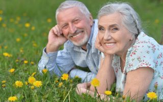 Seniors smiling With new dental implants - 5 Simple Steps To Restoring Your Smile At Dental Arts San Diego
