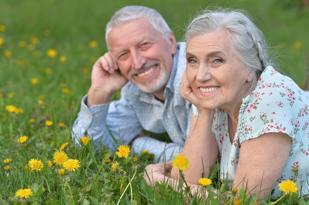 Seniors smiling With new dental implants - 5 Simple Steps To Restoring Your Smile At Dental Arts San Diego